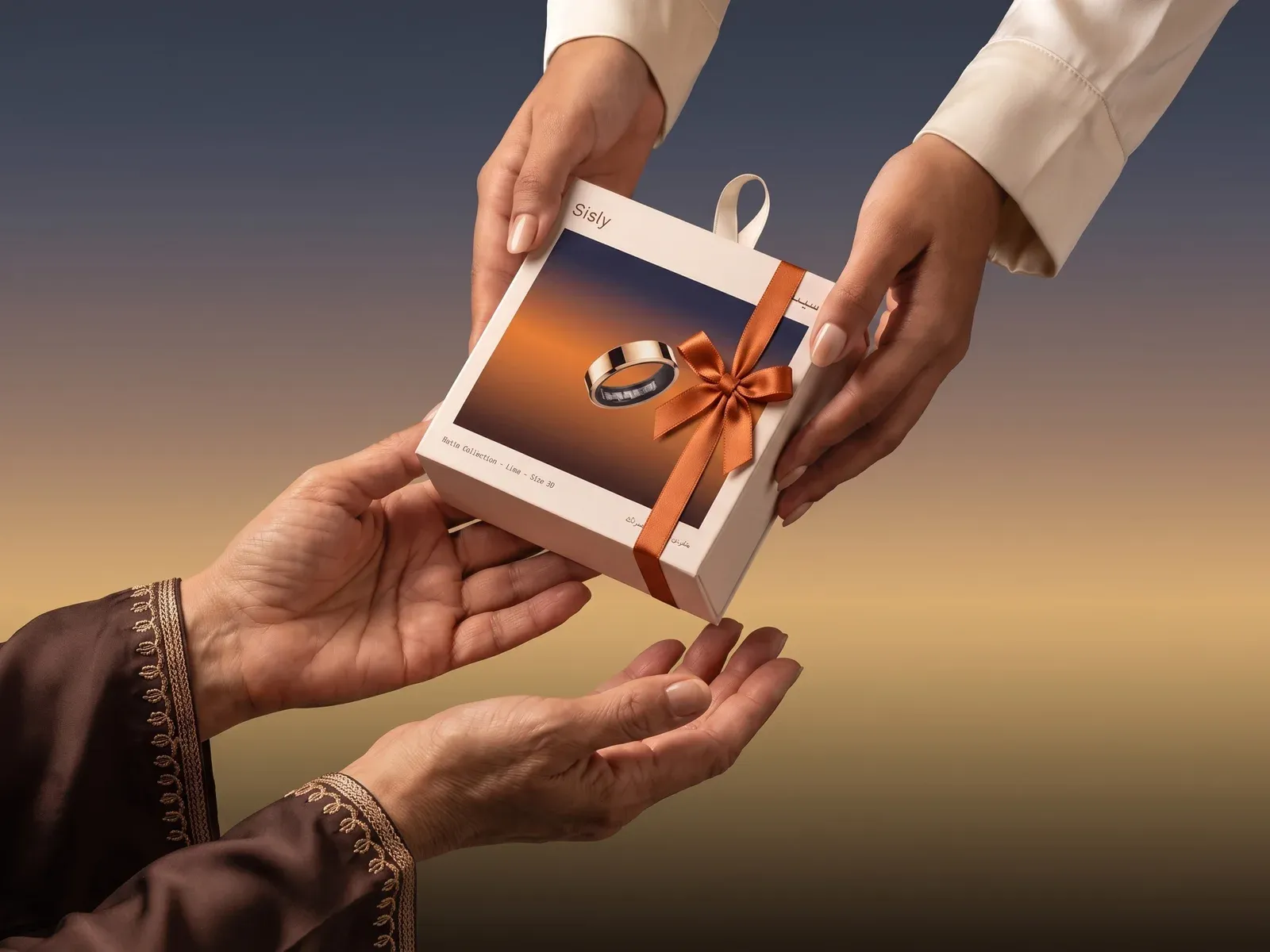 A Sisly ring box tied with an orange ribbon, the gold Liwa ring inside, passed from one pair of hands to another